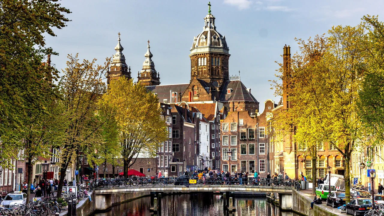 Amsterdam canal, bridge and historic waterfront buildings
