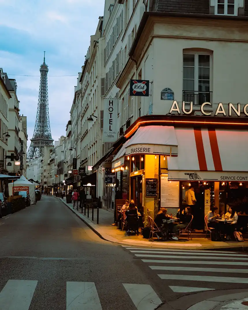 The Eiffel Tower framed by autumn leaves on a Paris city break