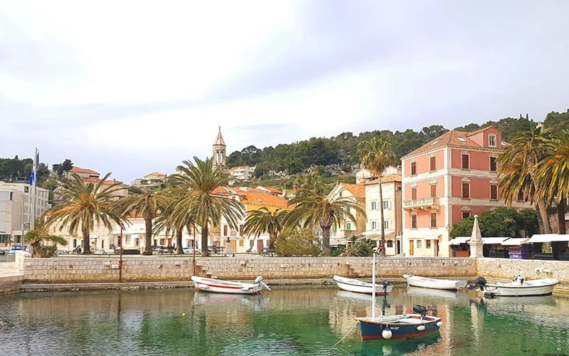 Discover Croatia - hvar town boats in a body of water with buildings and trees