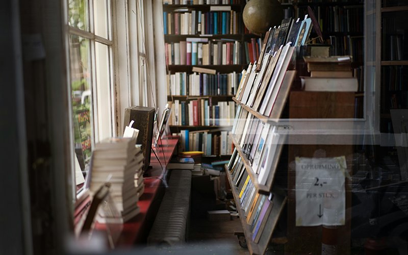 a bookshelf in a room with a window