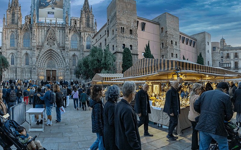 Barcelona City Breaks - a group of people standing in a market