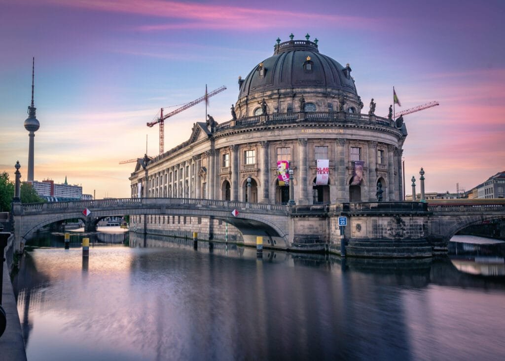 building beside water and bridge