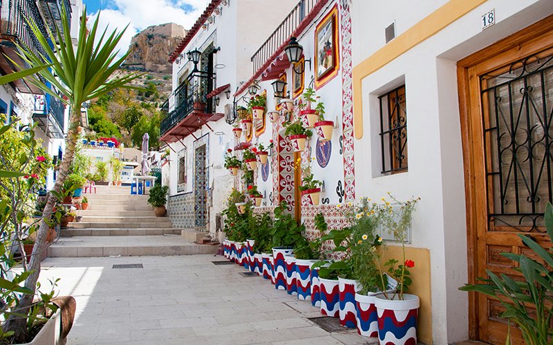 a building with pots on the side