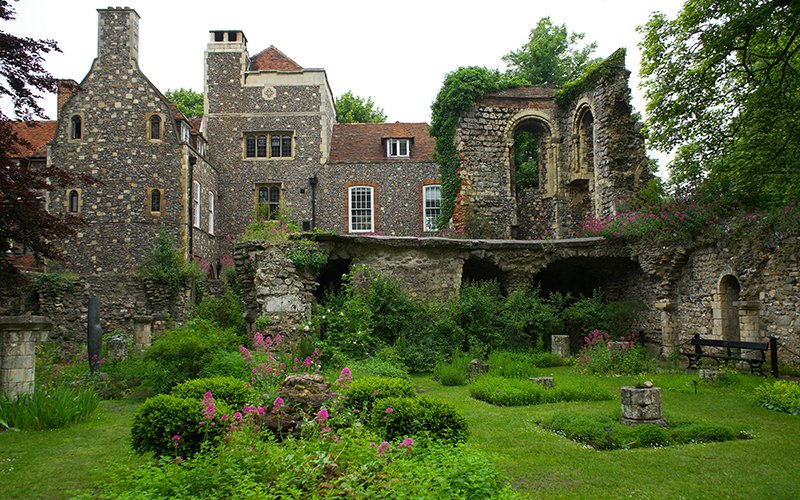 a stone building with a garden