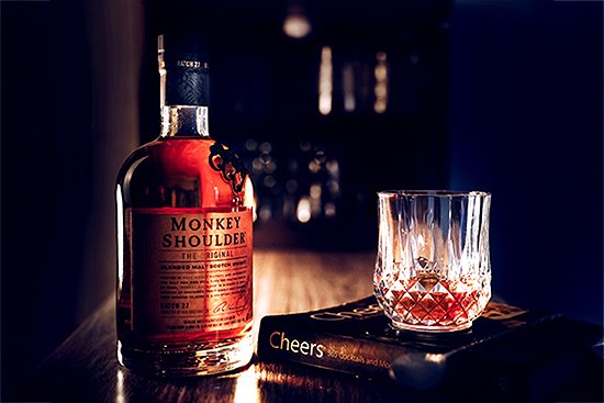 bottle and glass on table